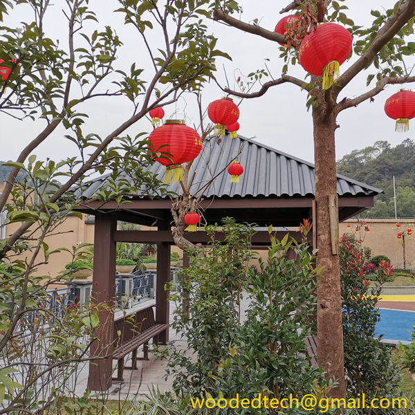 The twin WPC gazebo behind the bushes is more beautiful and stable