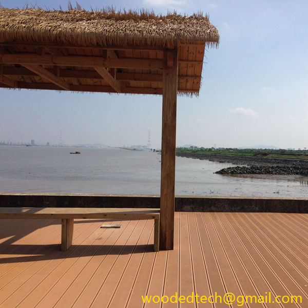 Beautiful 1×8 composite decking under the thatched pavilion