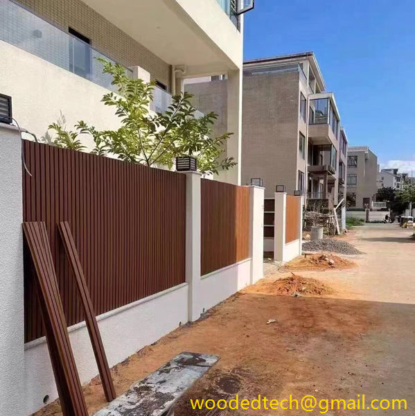 wood plastic cladding panels are used as the fence of the yard